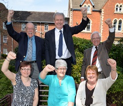 Trustees and hospital representatives celebrate the achievement