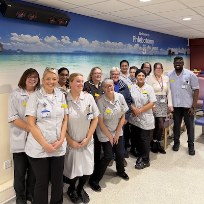 Phlebotomy team with mural